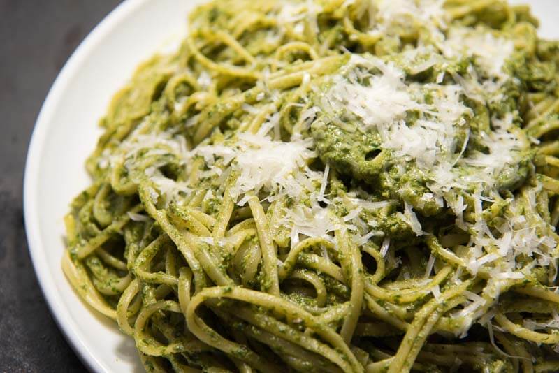 fettucine with arugula pesto parmesan on top