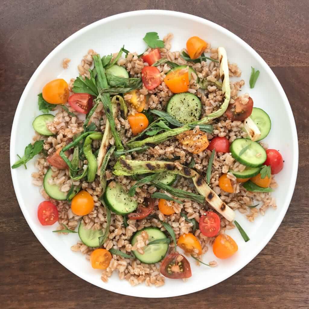 A throwback Thursday plate of grilled farro salad with tomatoes and cucumbers.