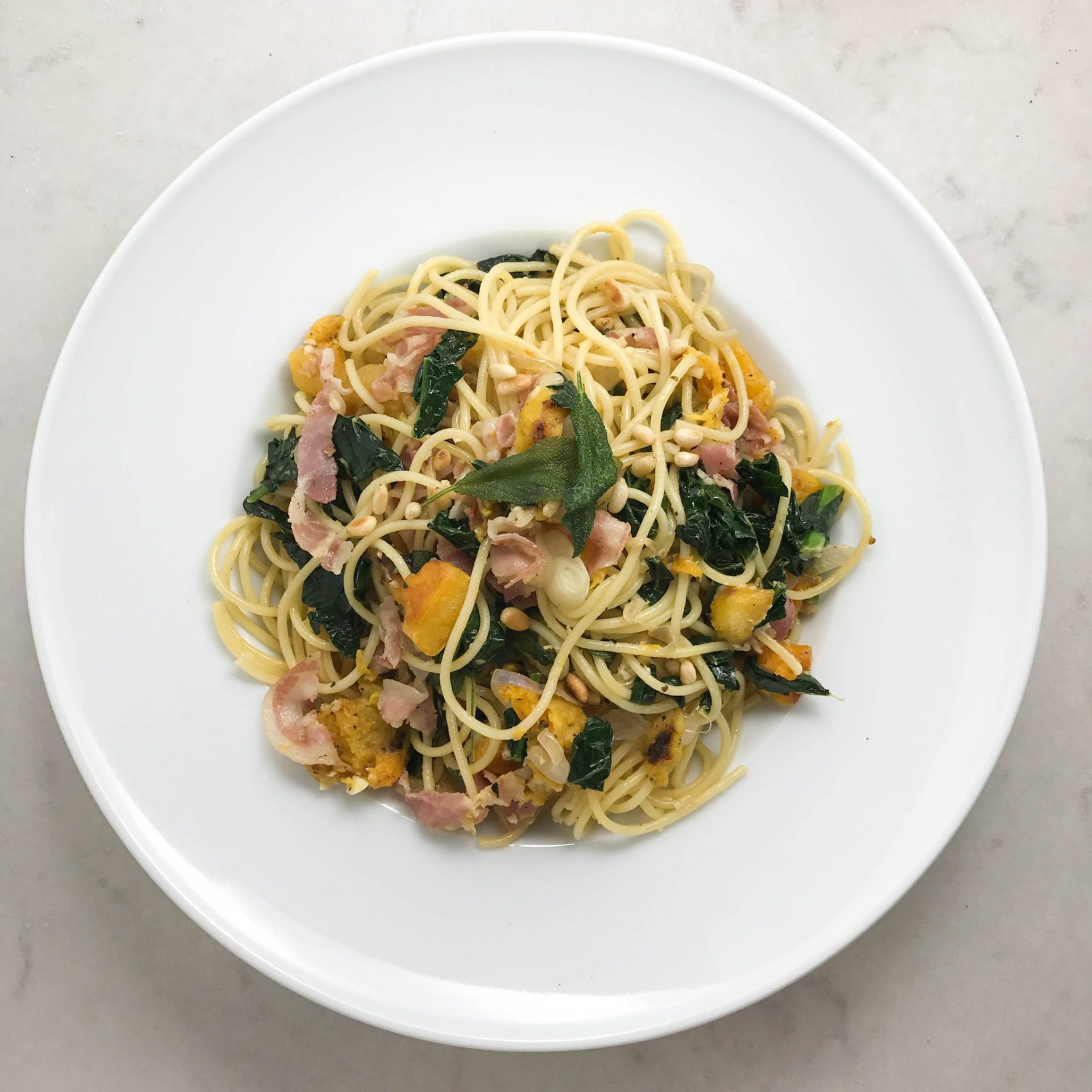 spaghetti with pancetta, kale, and butter squash top view