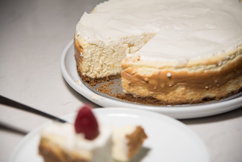 vanilla bean cheesecake walnut crust slice