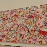 A large painting with many cartoon characters on it.