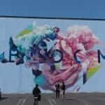 A mural of flowers on a building in los angeles.