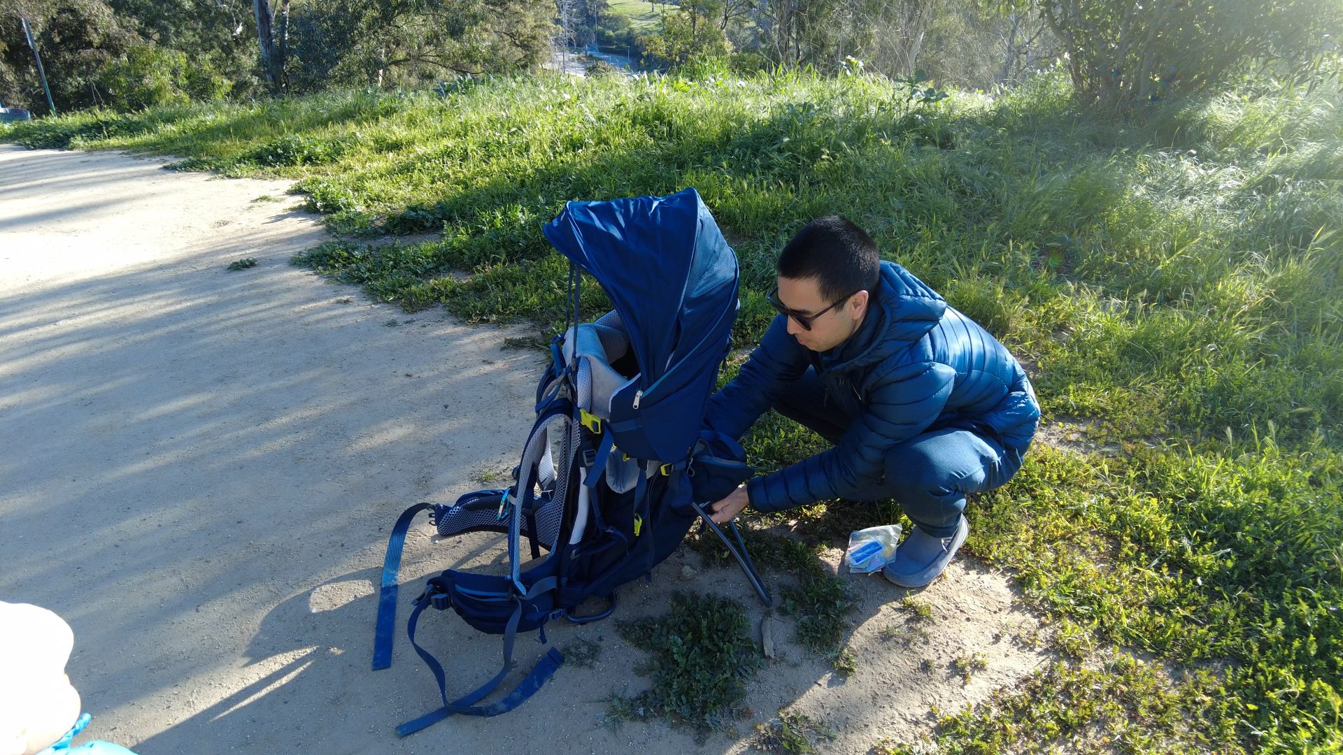 Pat Tokuyama with his blue deuter pro baby carrier