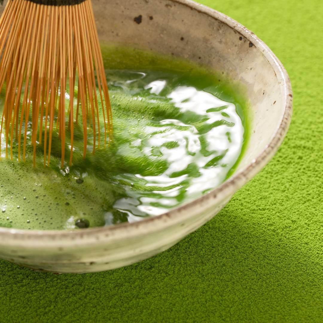 whisking matcha