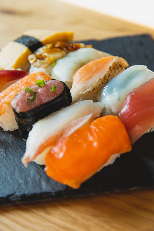 A plate of Sushi Grade Fish on a slate table.