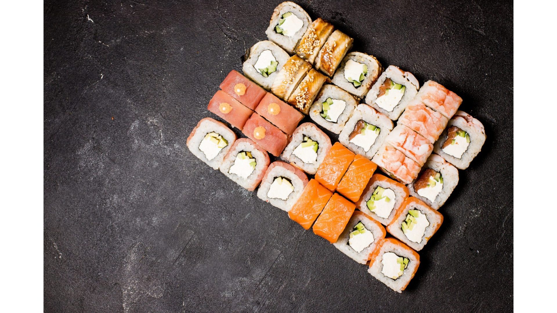 Japanese sushi on a black background.