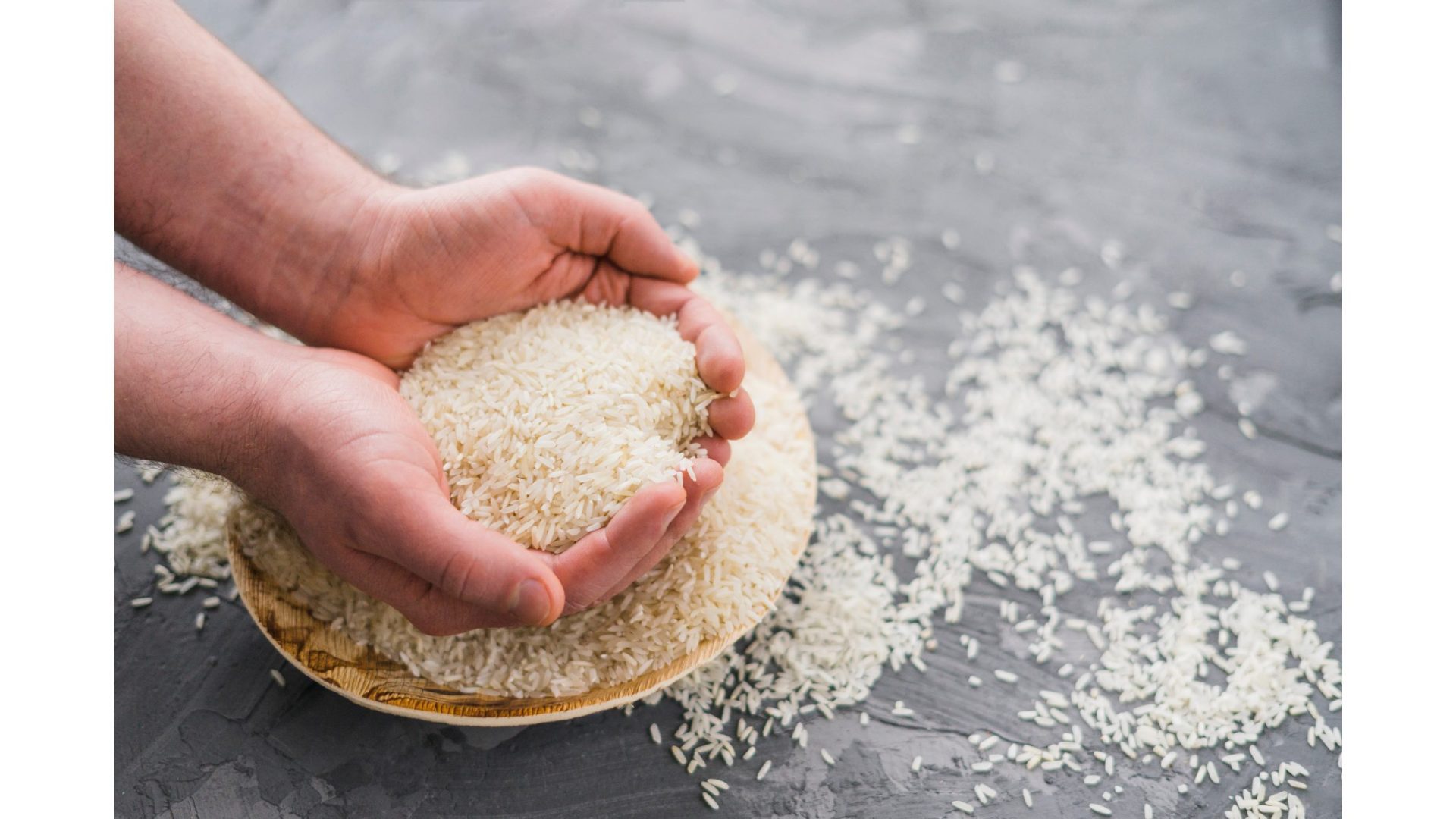 A person is holding a bowl of sushi rice.