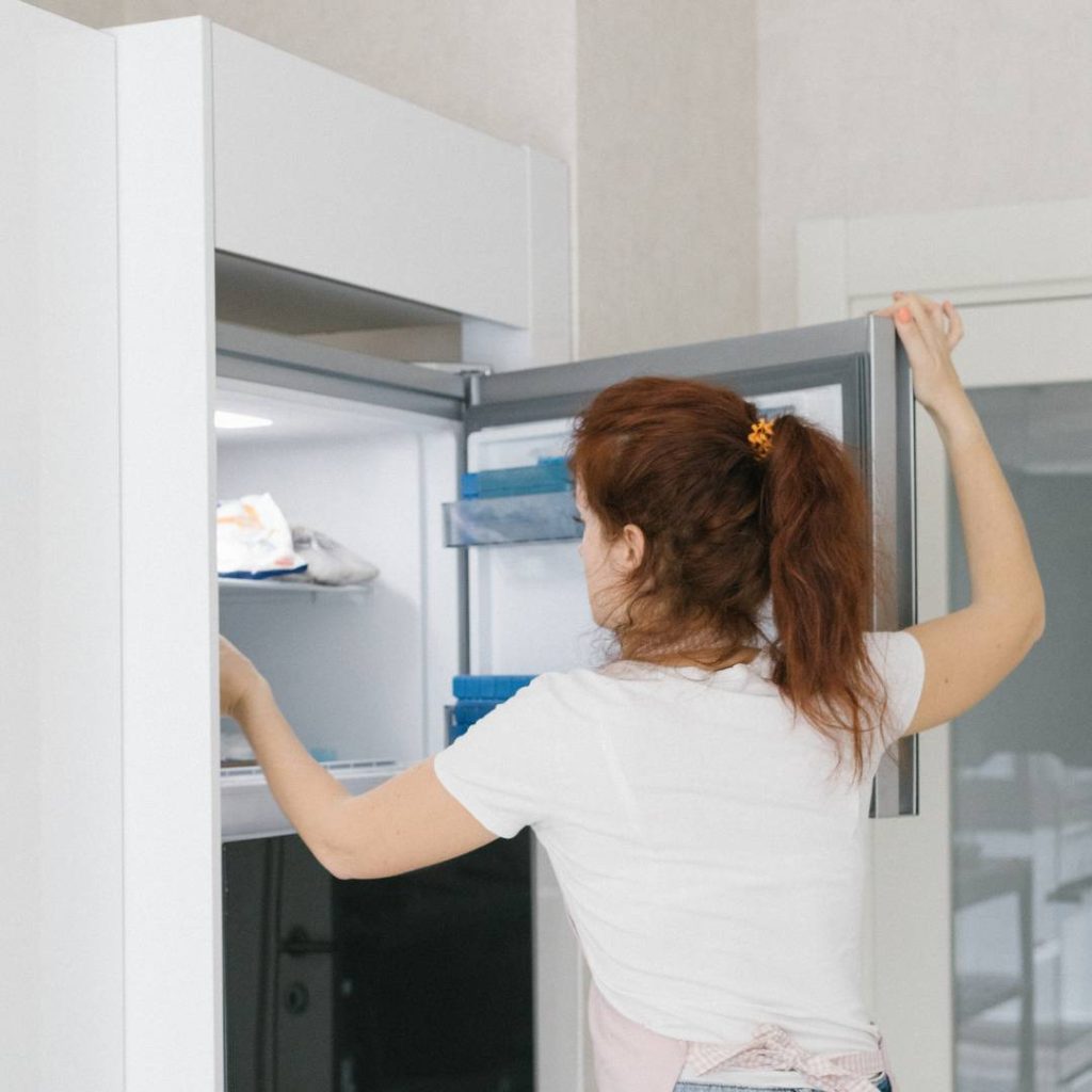 girl putting the miso paste in the freezer