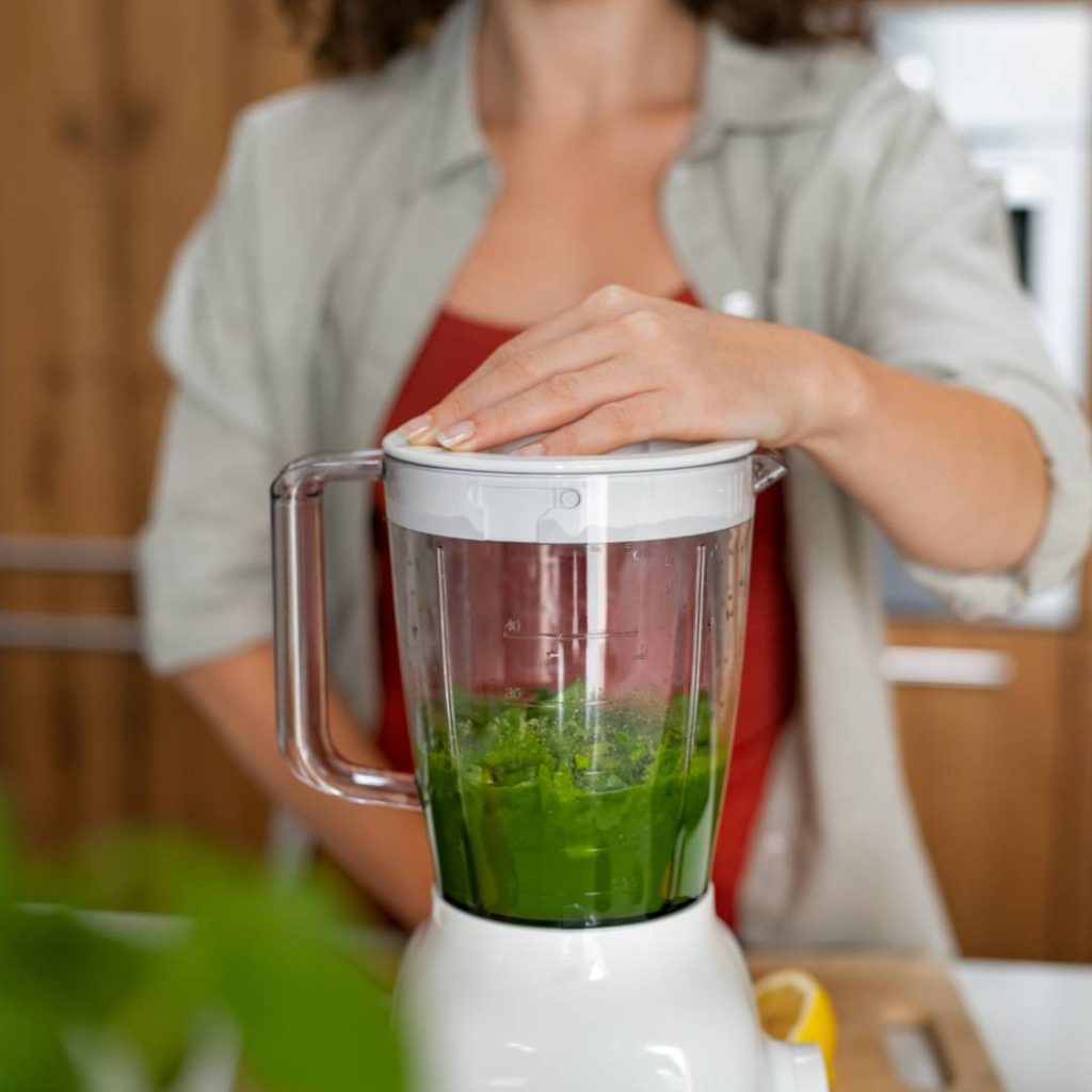 woman blending smoothie