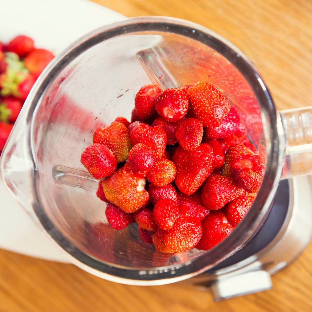 strawberry slushie in a vitamix blender