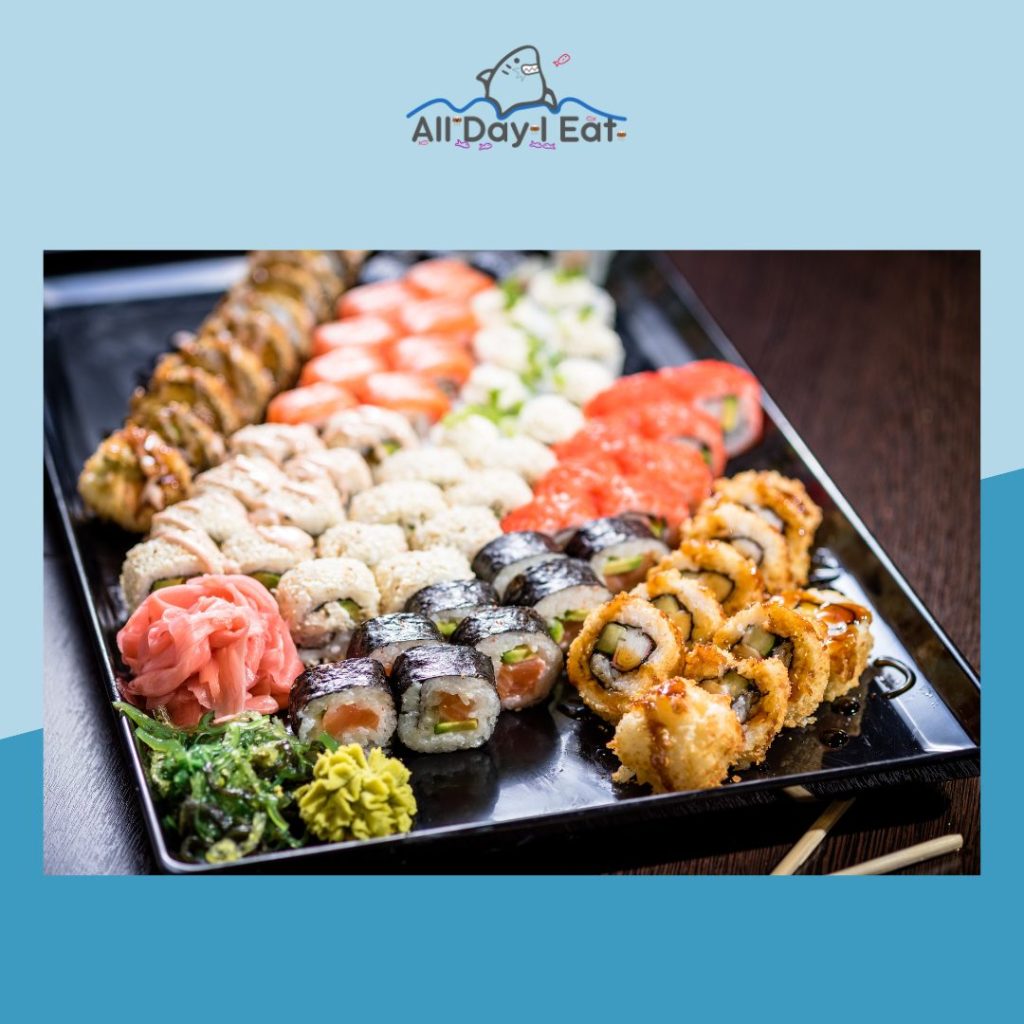 A tray of sushi, a seafood dish, on a blue background.