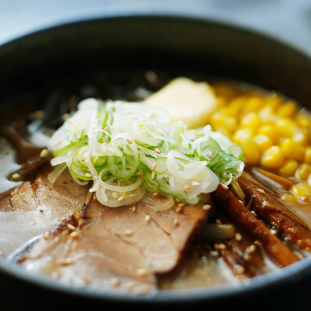 A Hokkaido-inspired bowl of ramen with meat and vegetables.