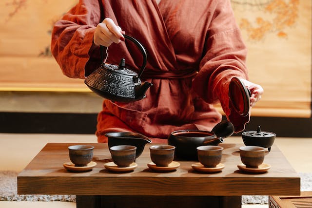 pouring hot water from a tea pot