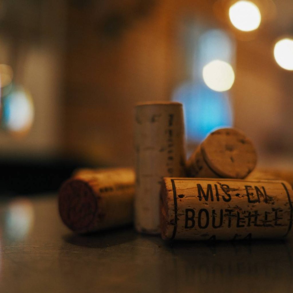 Wine corks on a table with blurred background captured using the Tamron 17-70mm lens.