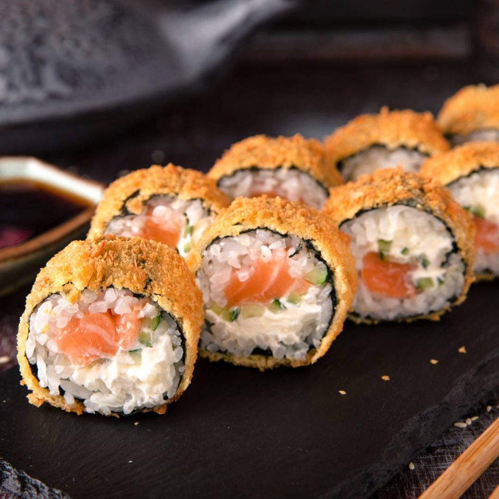 Japanese sushi rolls with salmon and cream cheese.