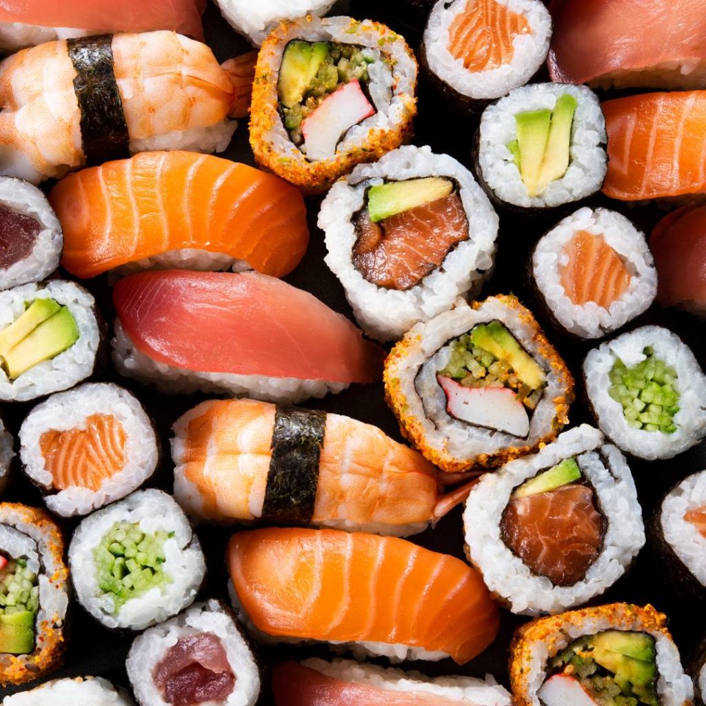 Handroll sushi on a black background.