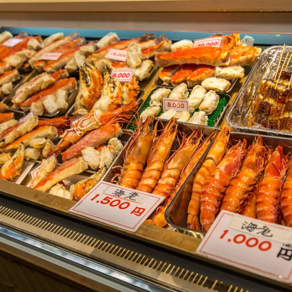 A display of seafood in a glass case.