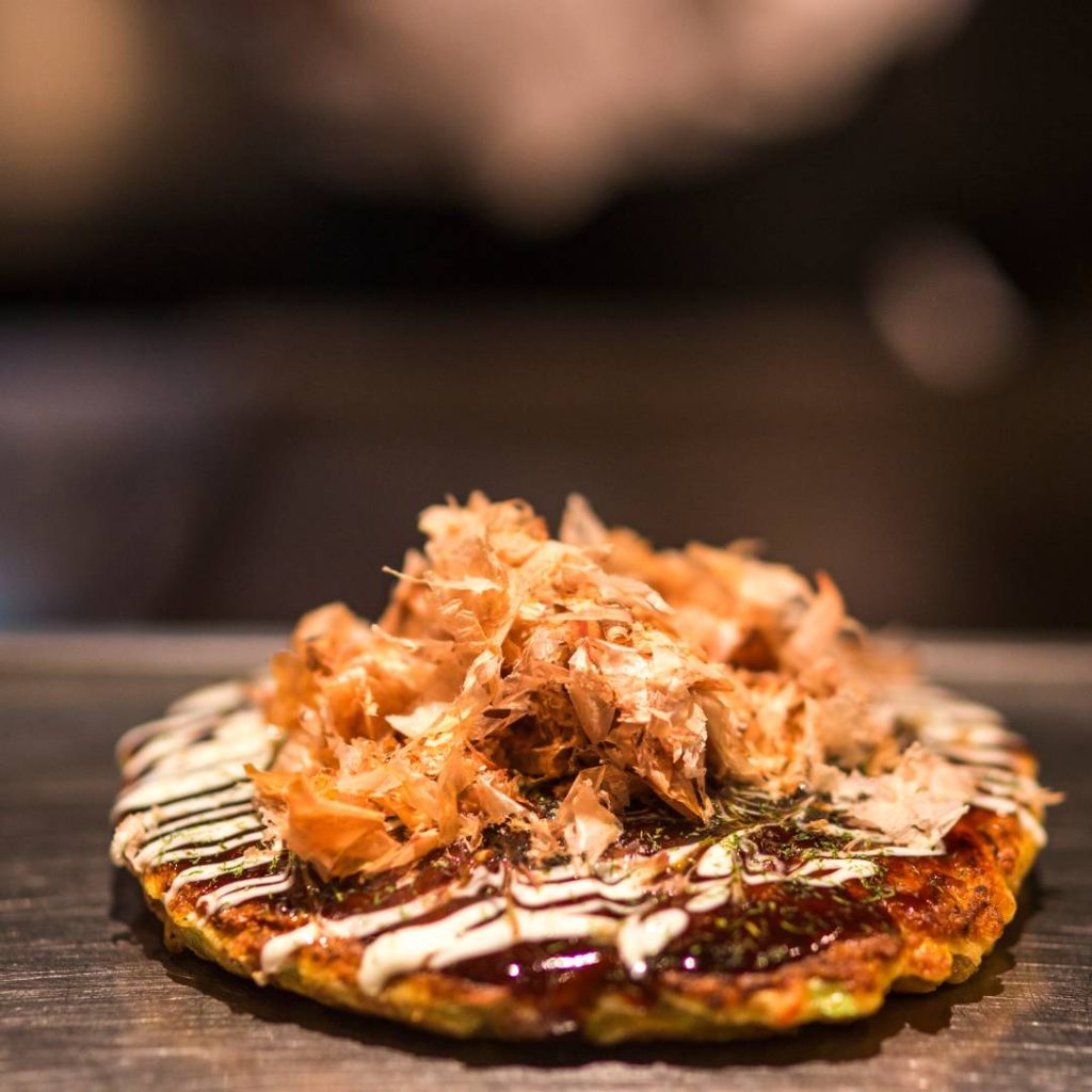 Osaka-style Japanese fried rice with kimchi on a metal plate.