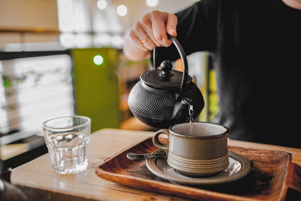 pouring hot water into a cup