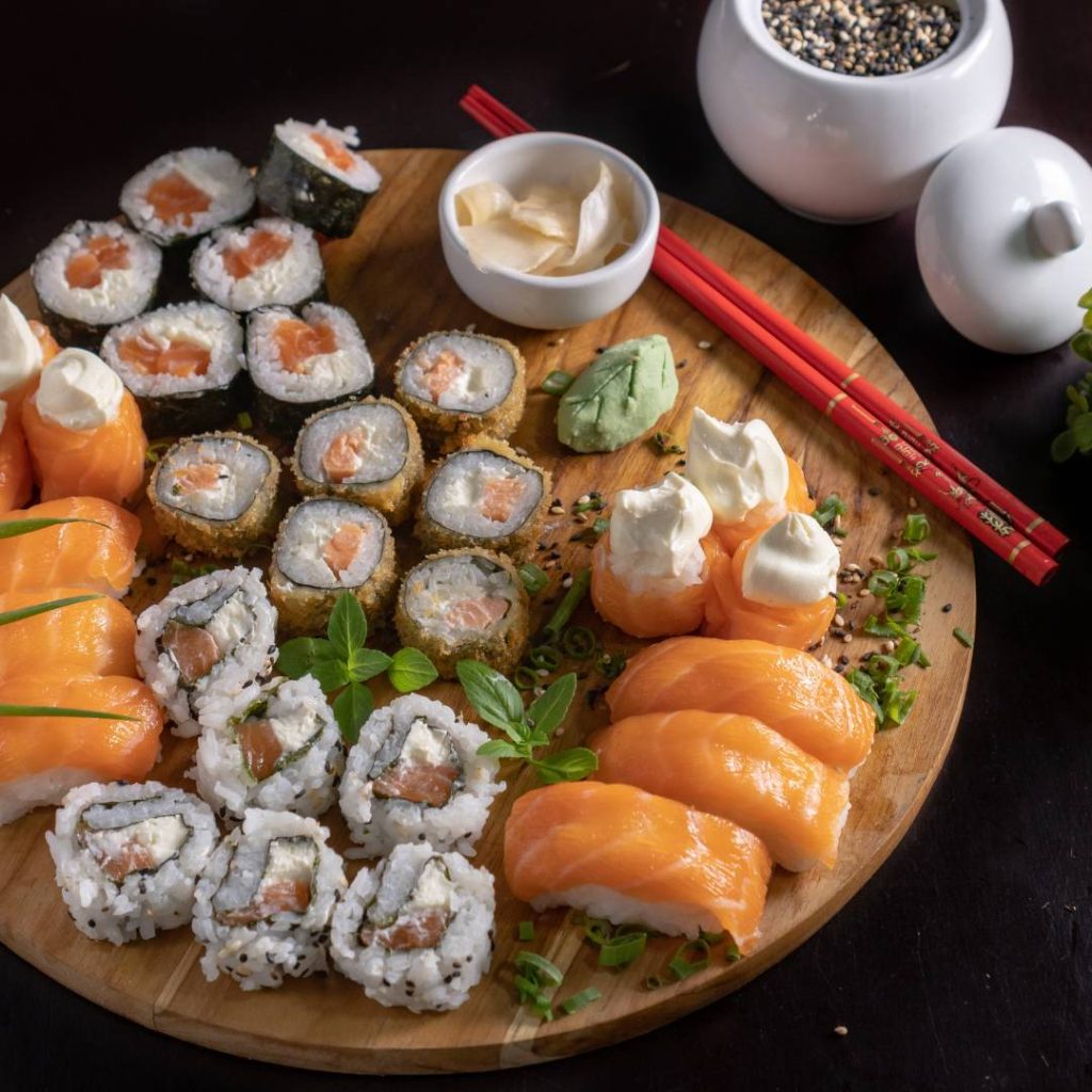 Sushi on a wooden plate with chopsticks 