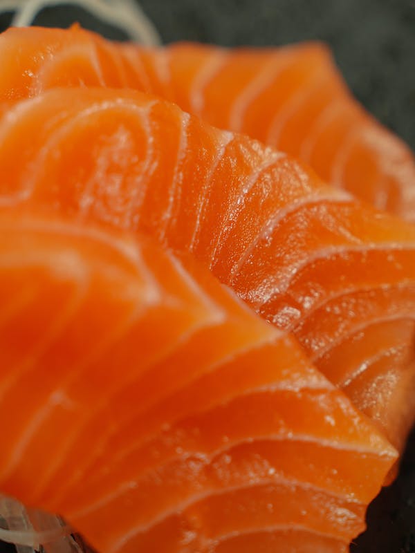 A close up of a sushi grade piece of salmon.