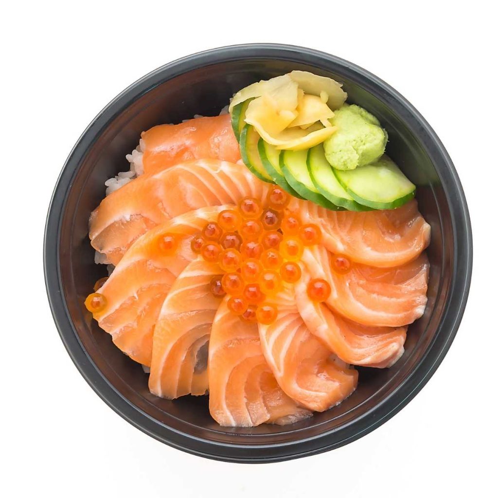 Sashimi in a bowl with a minimalist white backdrop