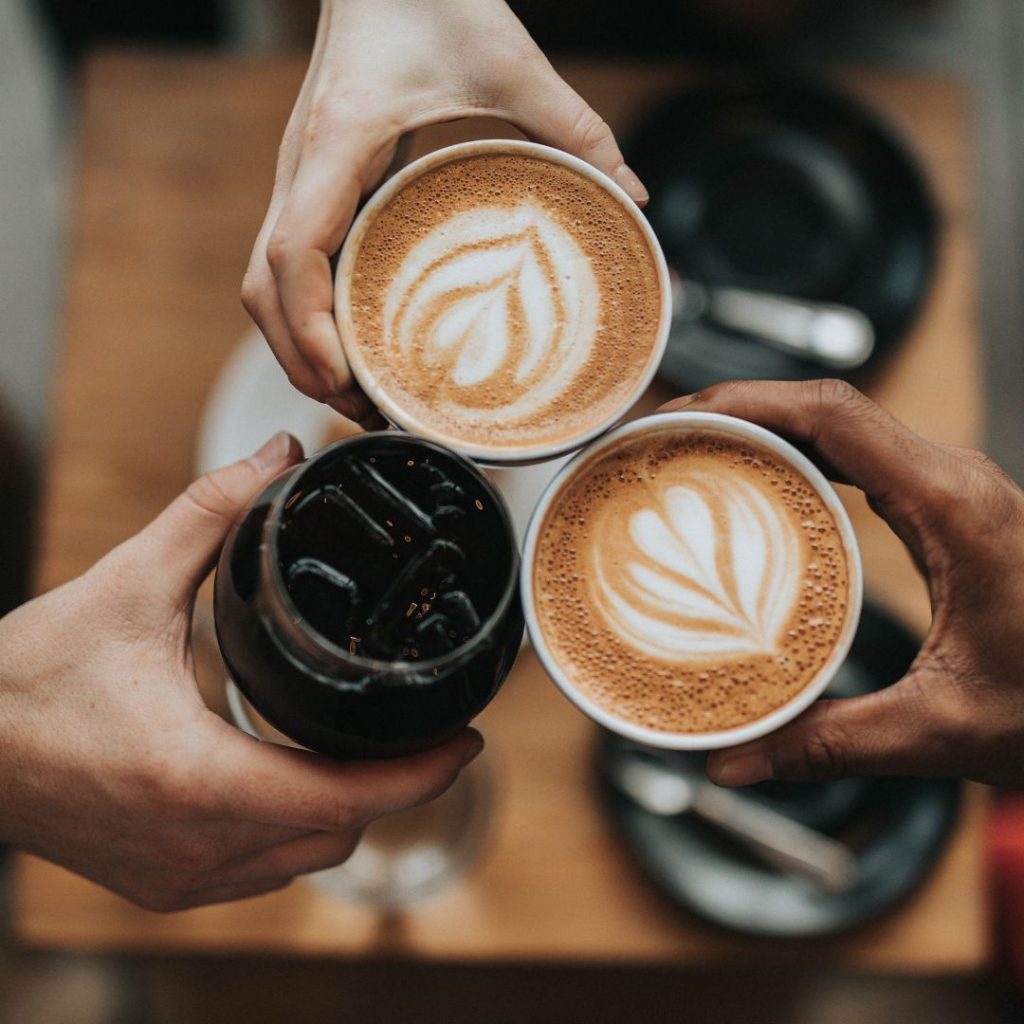 A group of people enjoying a cup of coffee