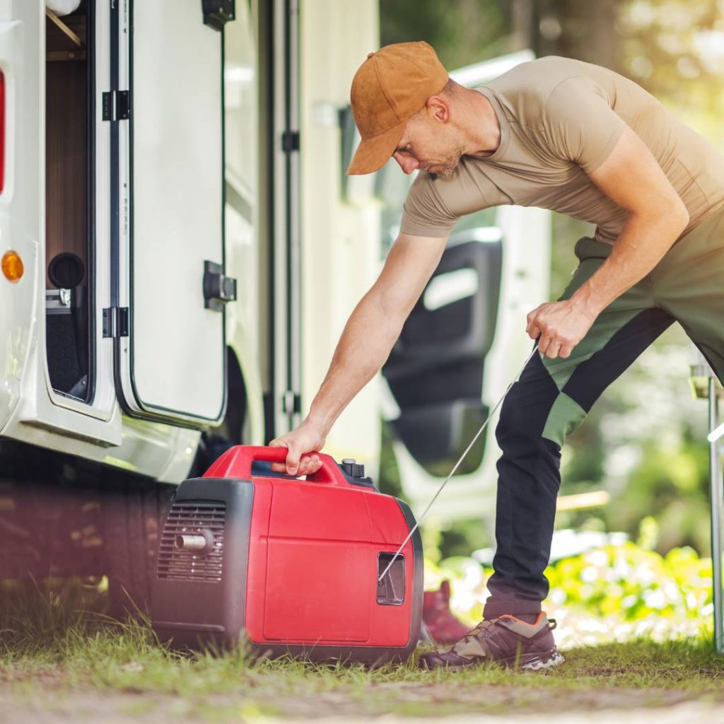 A man is putting a generator in front of his rv.