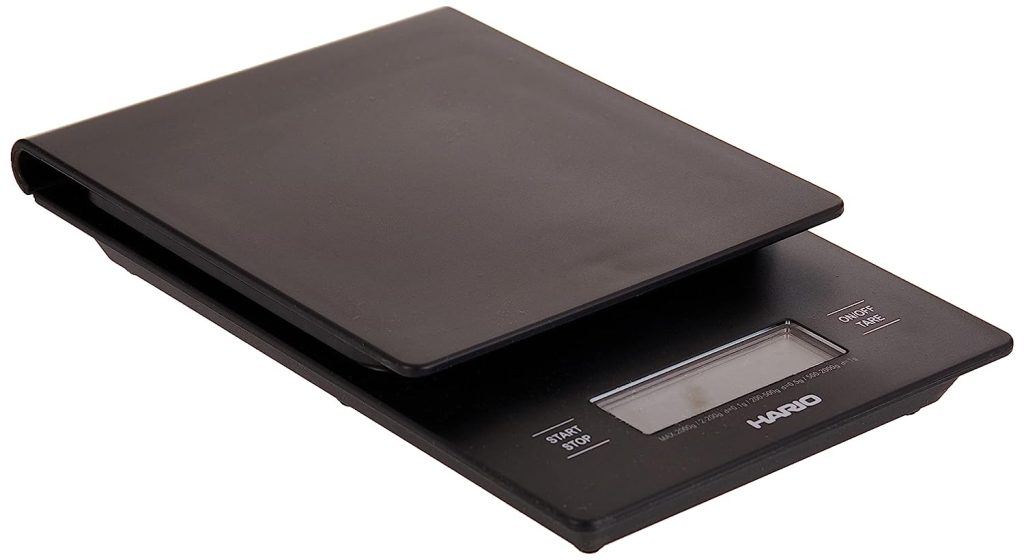 A black electronic scale with Hario V60 Drip Scale Review written on a white background.