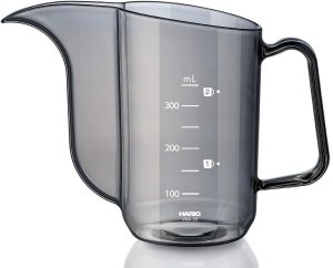 Hario Air Kettle Review: A glass pitcher with a handle on a white surface.