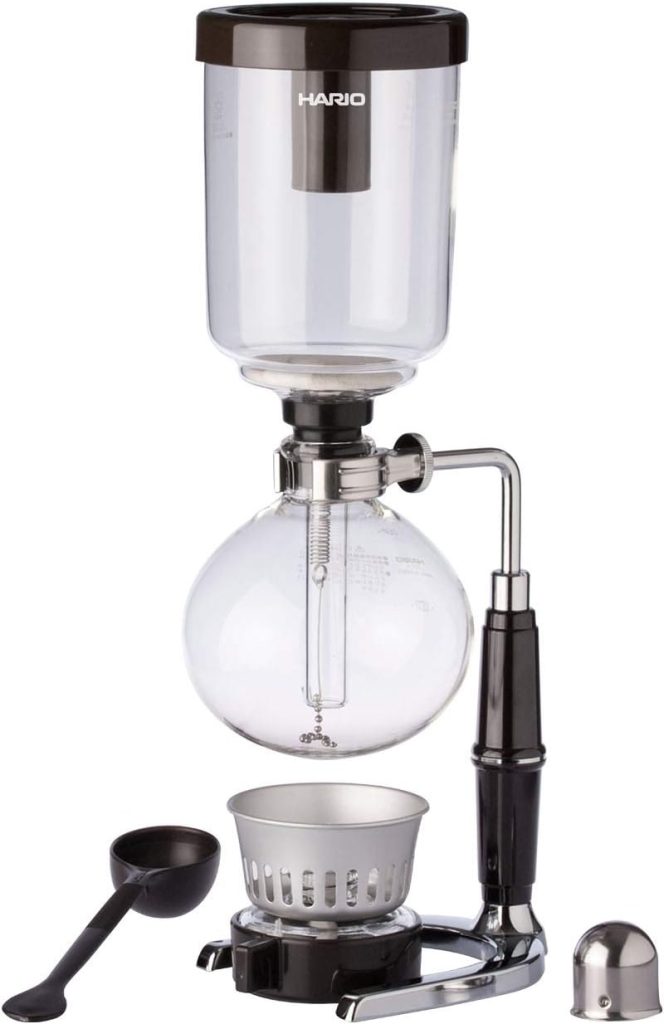 A Hario Syphon coffee maker with a bowl and spoon.