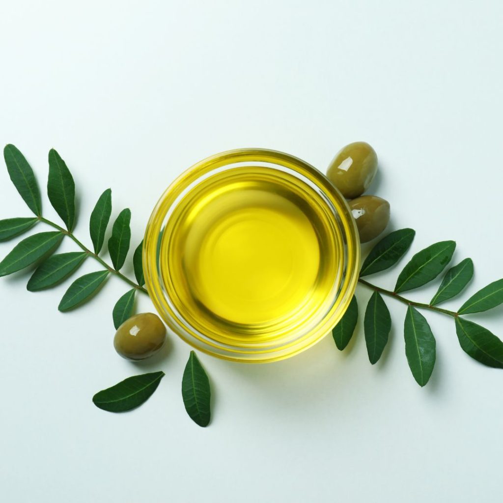 Olive oil on a plain background.