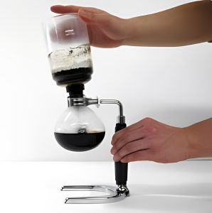 Premium Photo  Barista is boil water in syphon device for