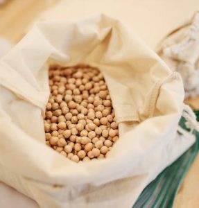 A bag filled with soy beans for miso soup on a table.