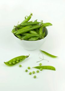 A white bowl with green wasabi peas in it to demonstrate how are wasabi peas healthy