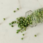 Wasabi Green Peas in a glass jar.