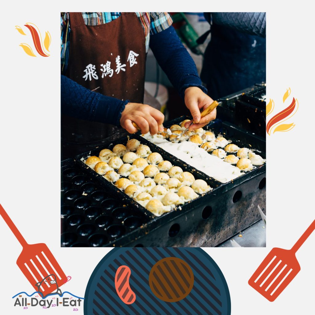 Delicious takoyaki balls being cooked by a Japanese women on a takoyaki pan to show how to use a takoyaki pan