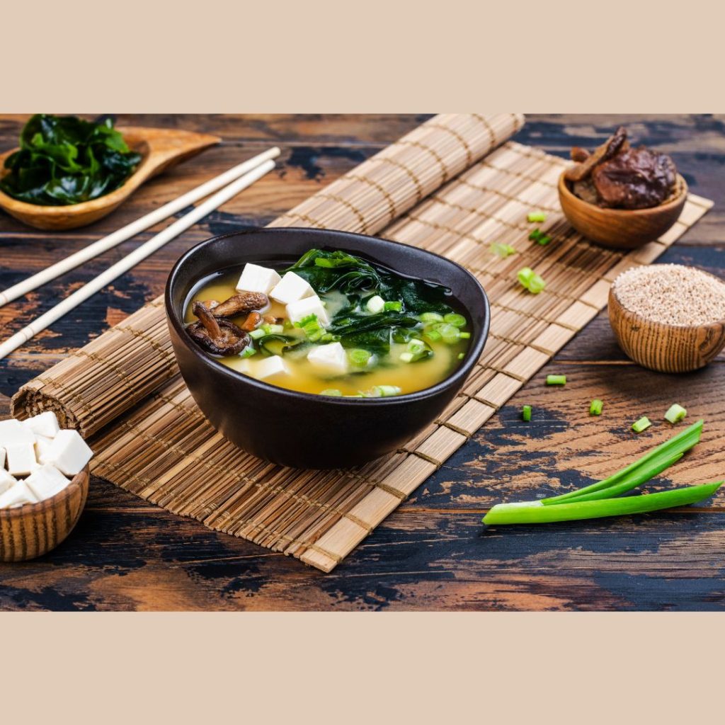 A miso soup with greens and tofu.