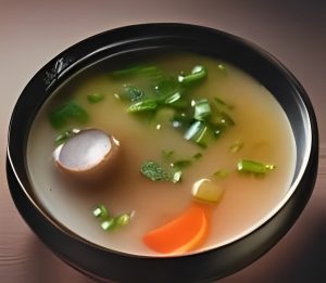 A miso soup filled with vegetables.