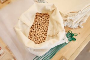 Chickpeas in a bag on a wooden table with miso soup.