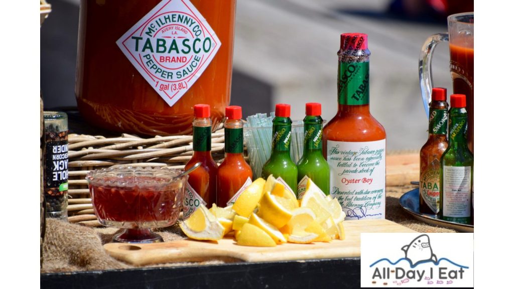 A table with hot sauces and lemons, perfect for a Takoyaki Sauce Recipe.