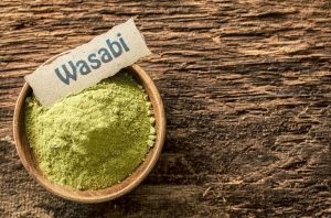 wasabi powder in a wooden bowl for display in the discussion, does wasabi kill bacteria?