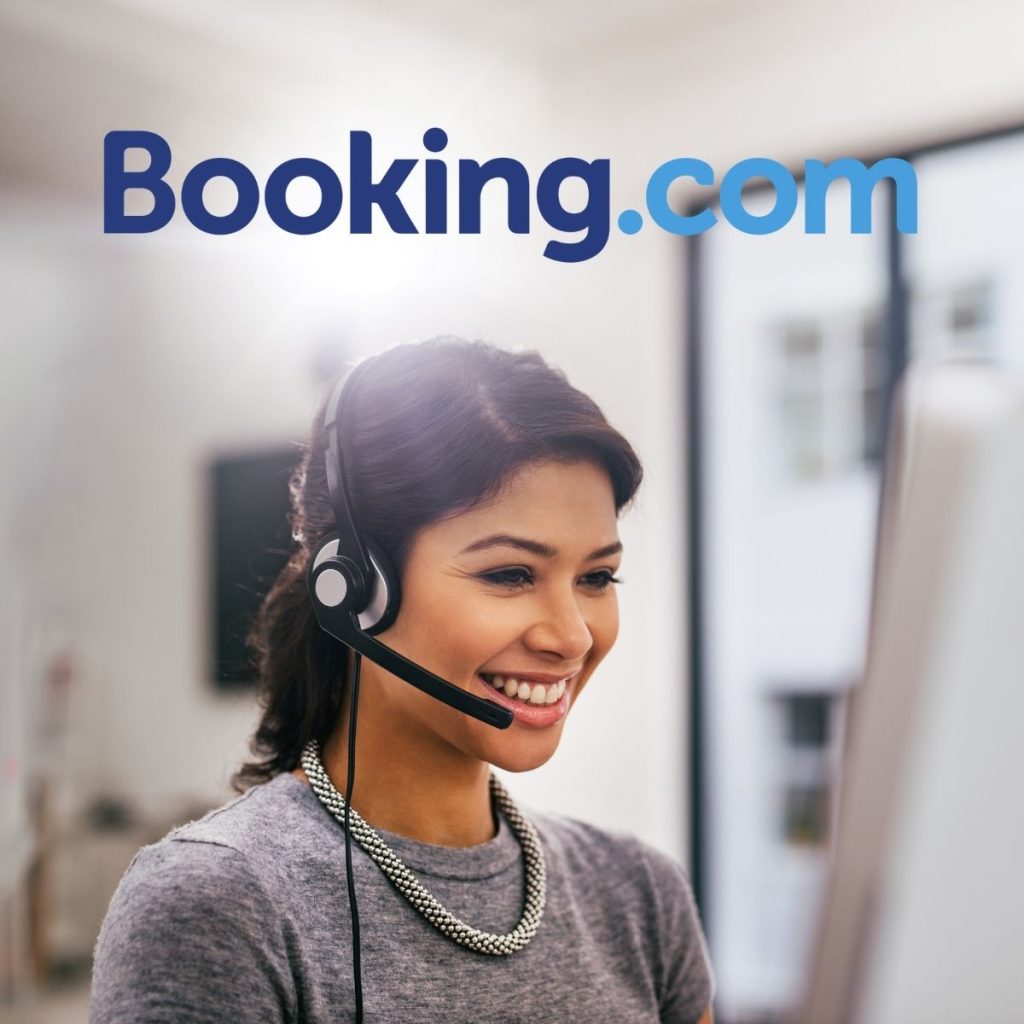 A photo shows a customer service representative taking a call, which represents the question Does Booking.com Have 24 Hour Customer Service?