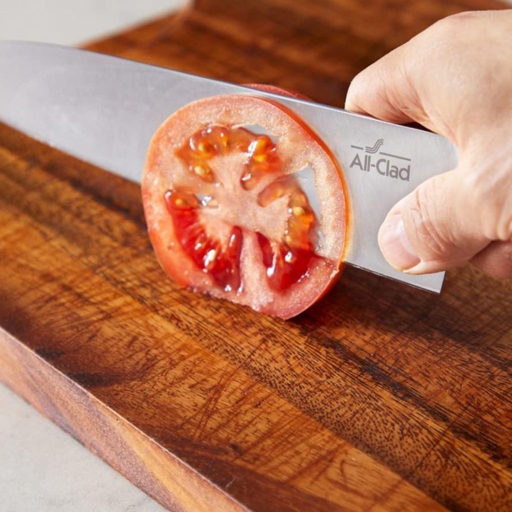 https://alldayieat.com/wp-content/uploads/2023/10/2-An-All-Clad-forged-knife-cuts-a-tomato.-Photo-courtesy-of-Amazon-1024x1024.jpg