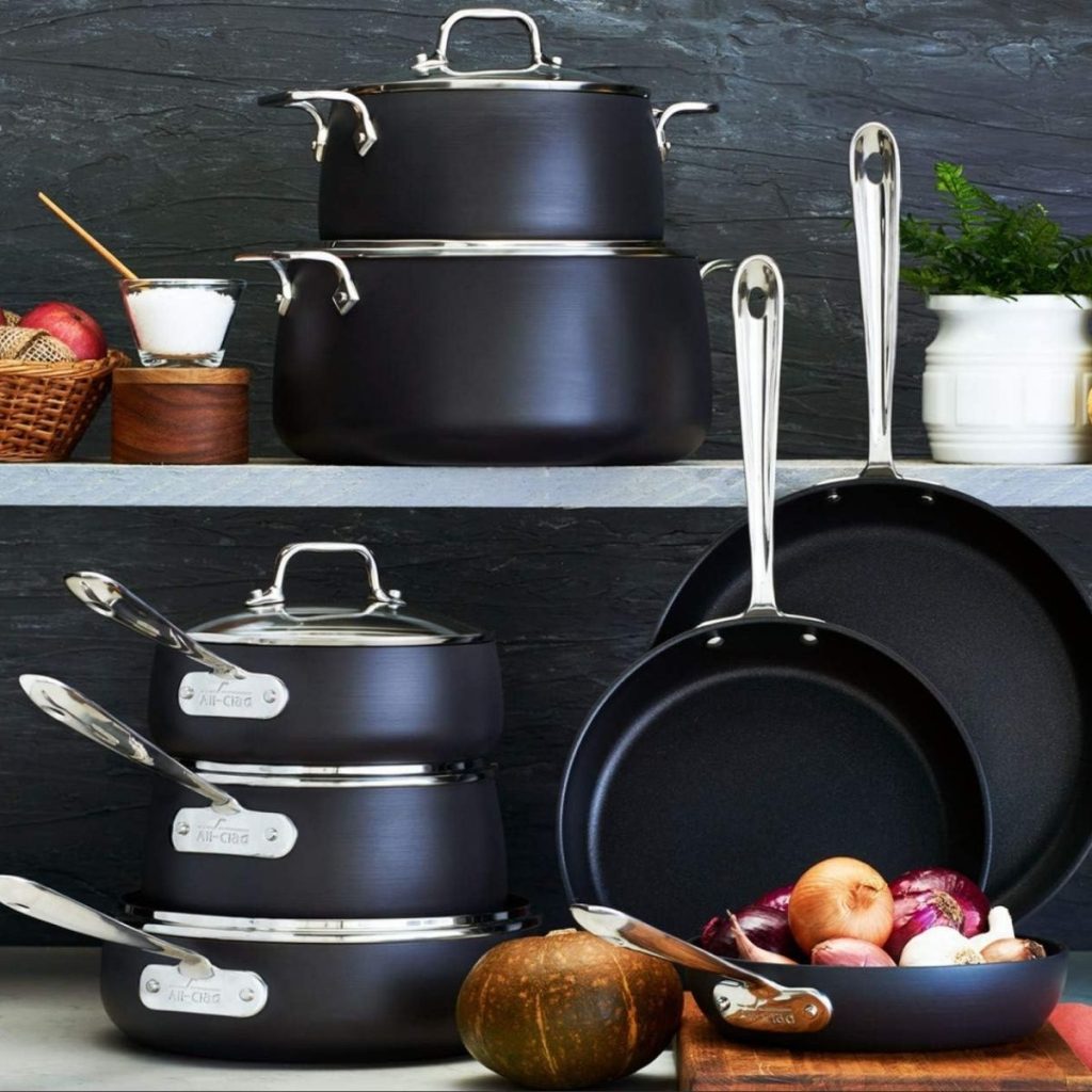 All-Clad Hard Anodized Cookware rests on a kitchen counter with vegetables and fruits. (Photo courtesy of Amazon)