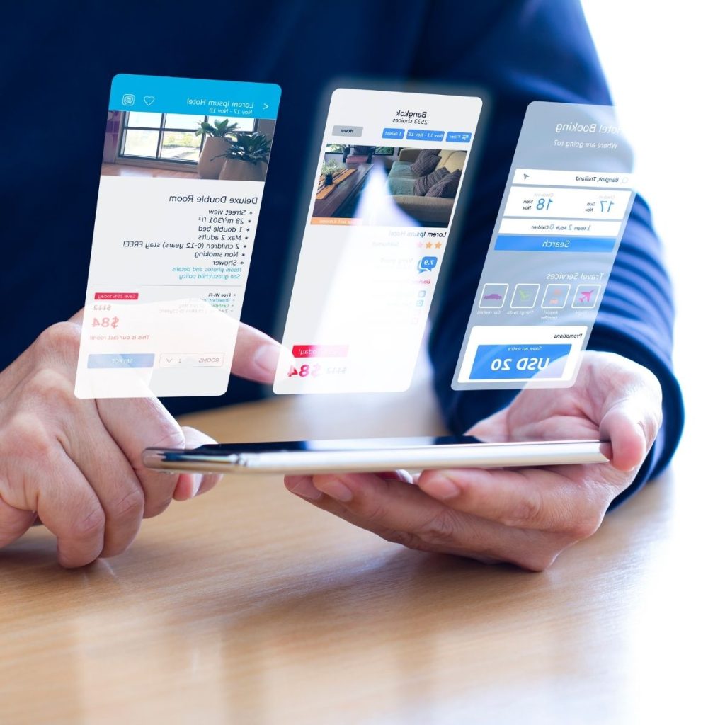 A human glances at his phone to compare the prices of hotels in his area.