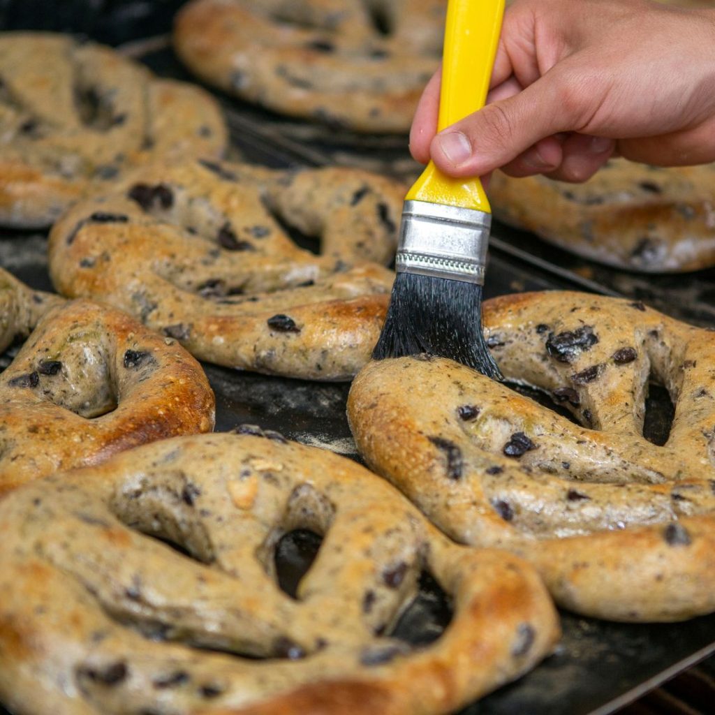 Extra virgin olive oil gets brushed on freshly baked cookies.