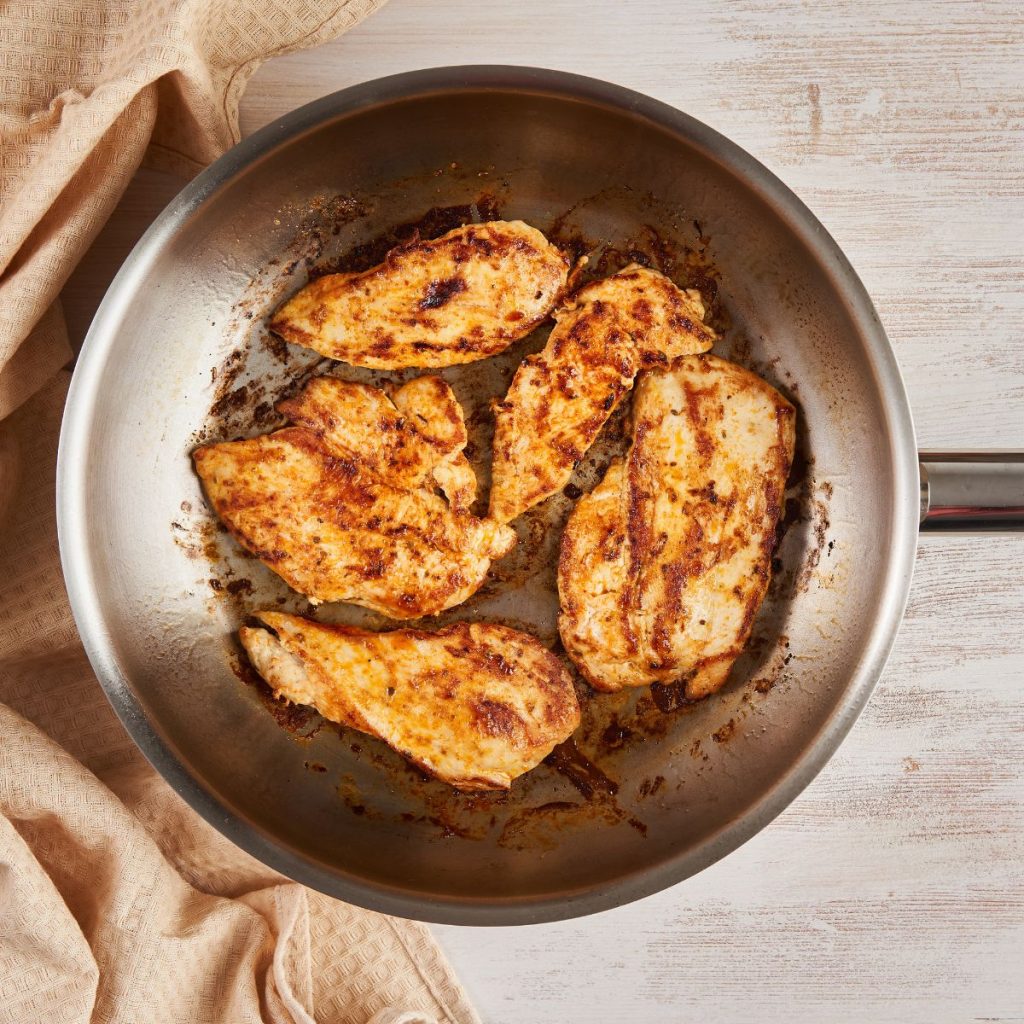 Chicken breasts are pan-fried on an All-Clad Weeknight Pan.