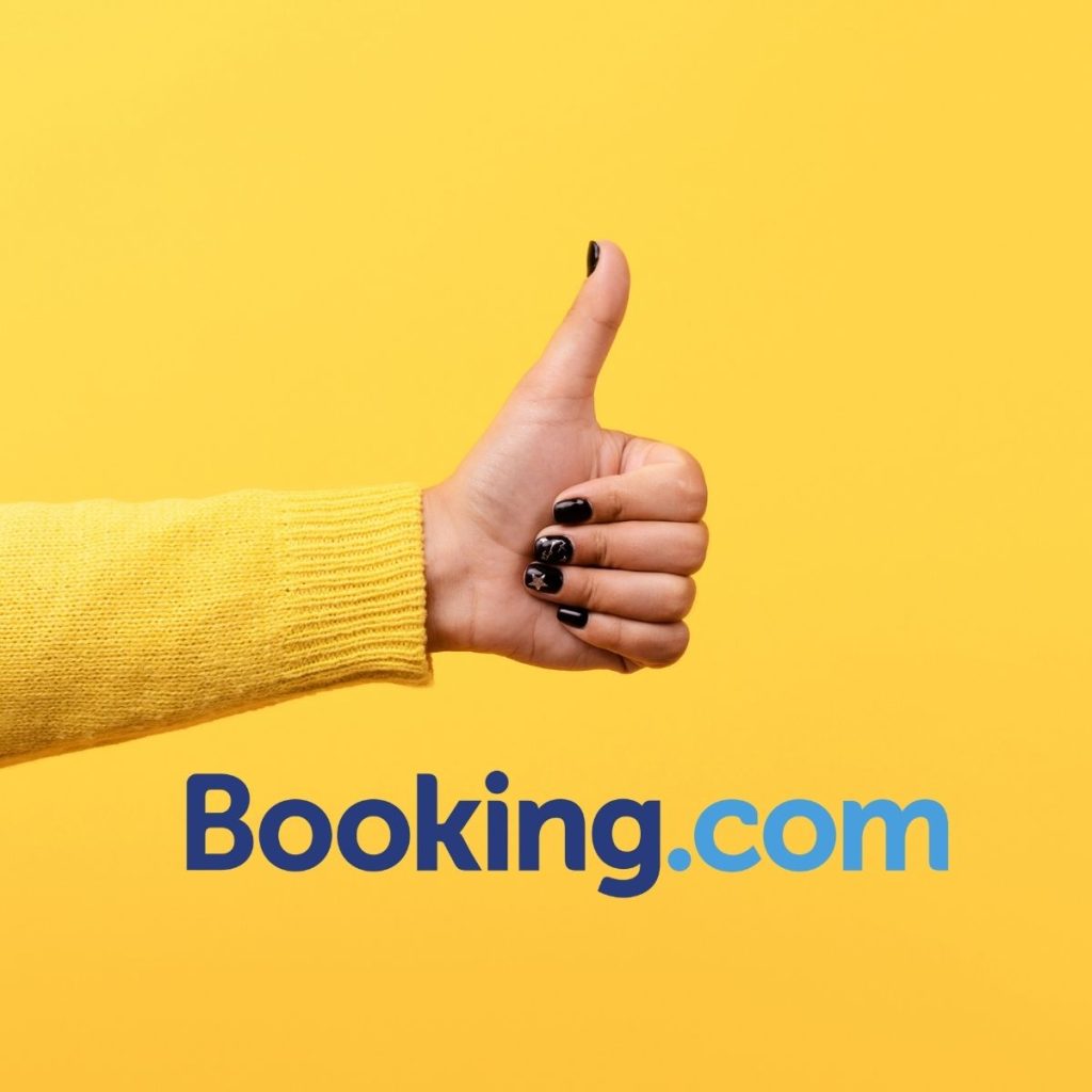 The Booking.com logo is laid out below a photo of a thumbs-up.