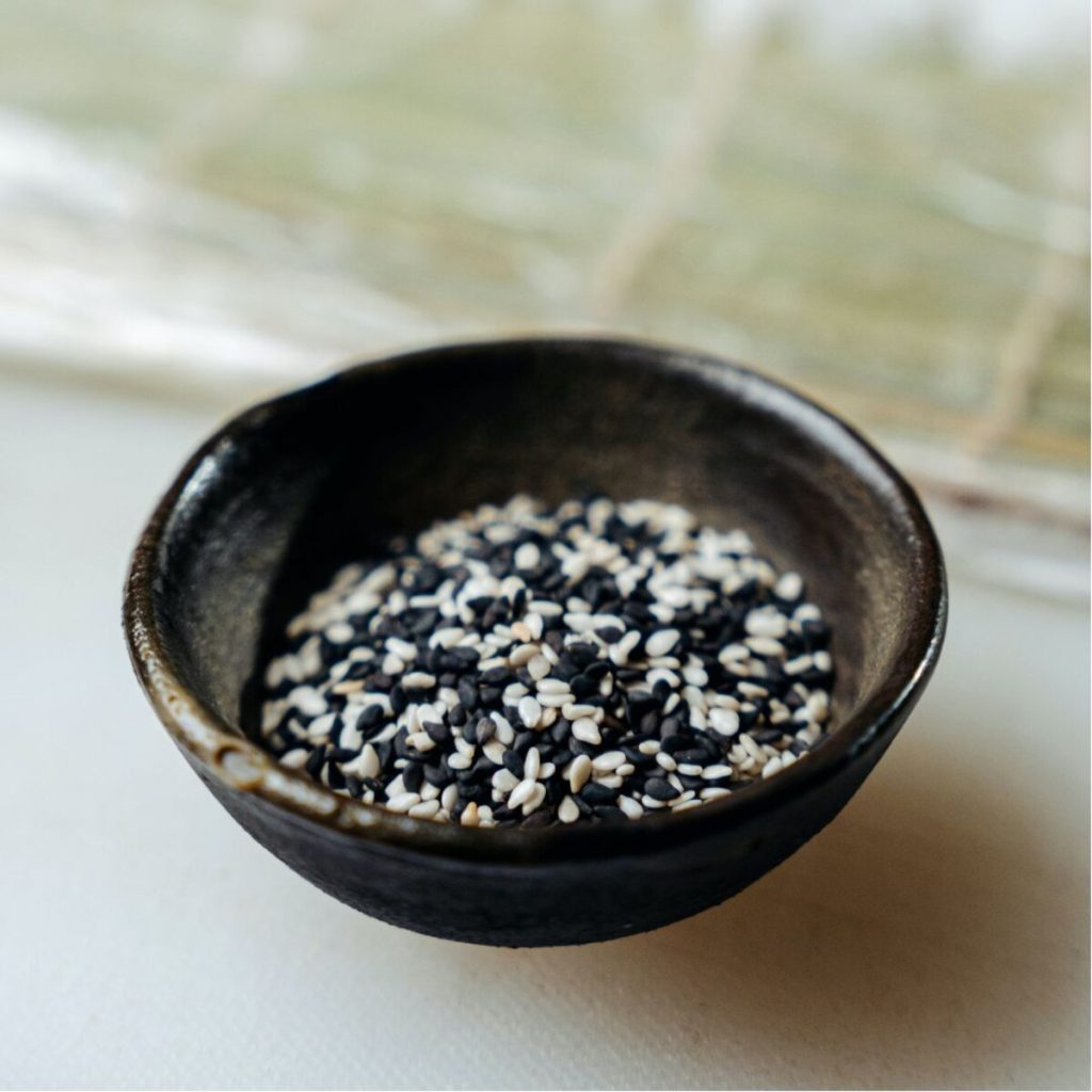 A bowl of black and white sesame seeds